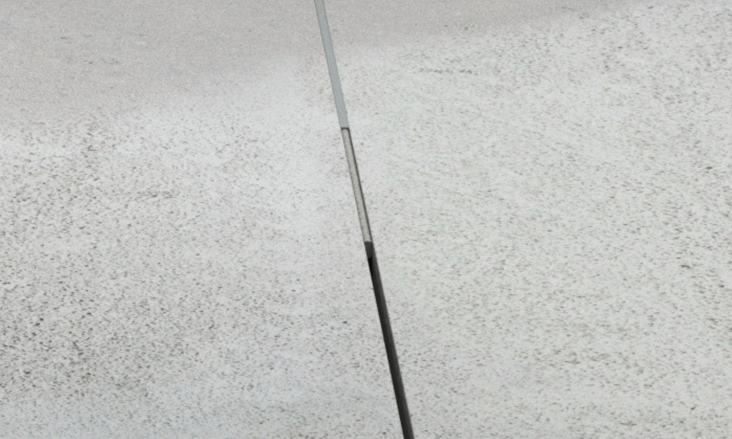 Close-up view of sealing with backer rod the concrete floor shrinkage joints